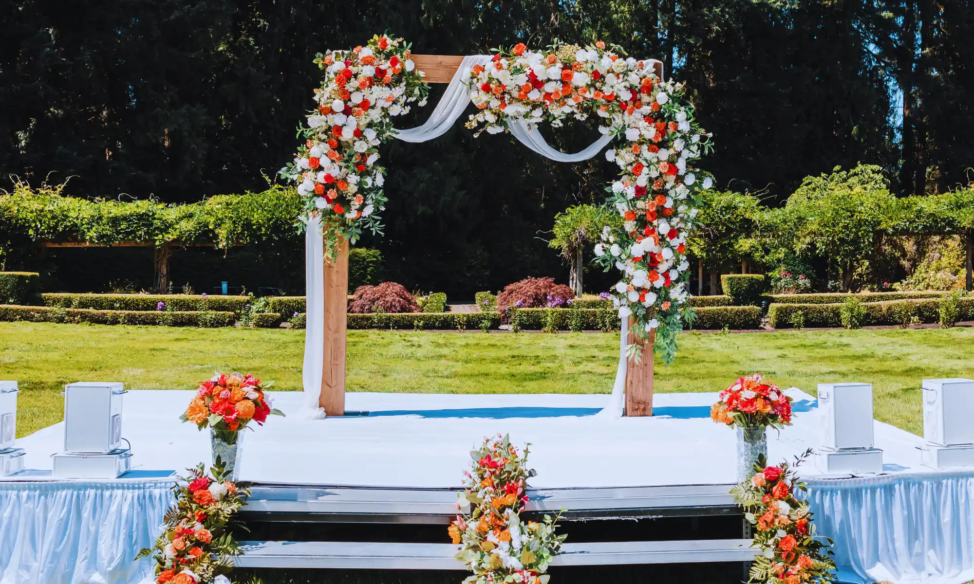 Destination Wedding Ceremony Arch | Carnation Farms Outdoor wedding ceremony arch decorated with flowers at a destination wedding venue.