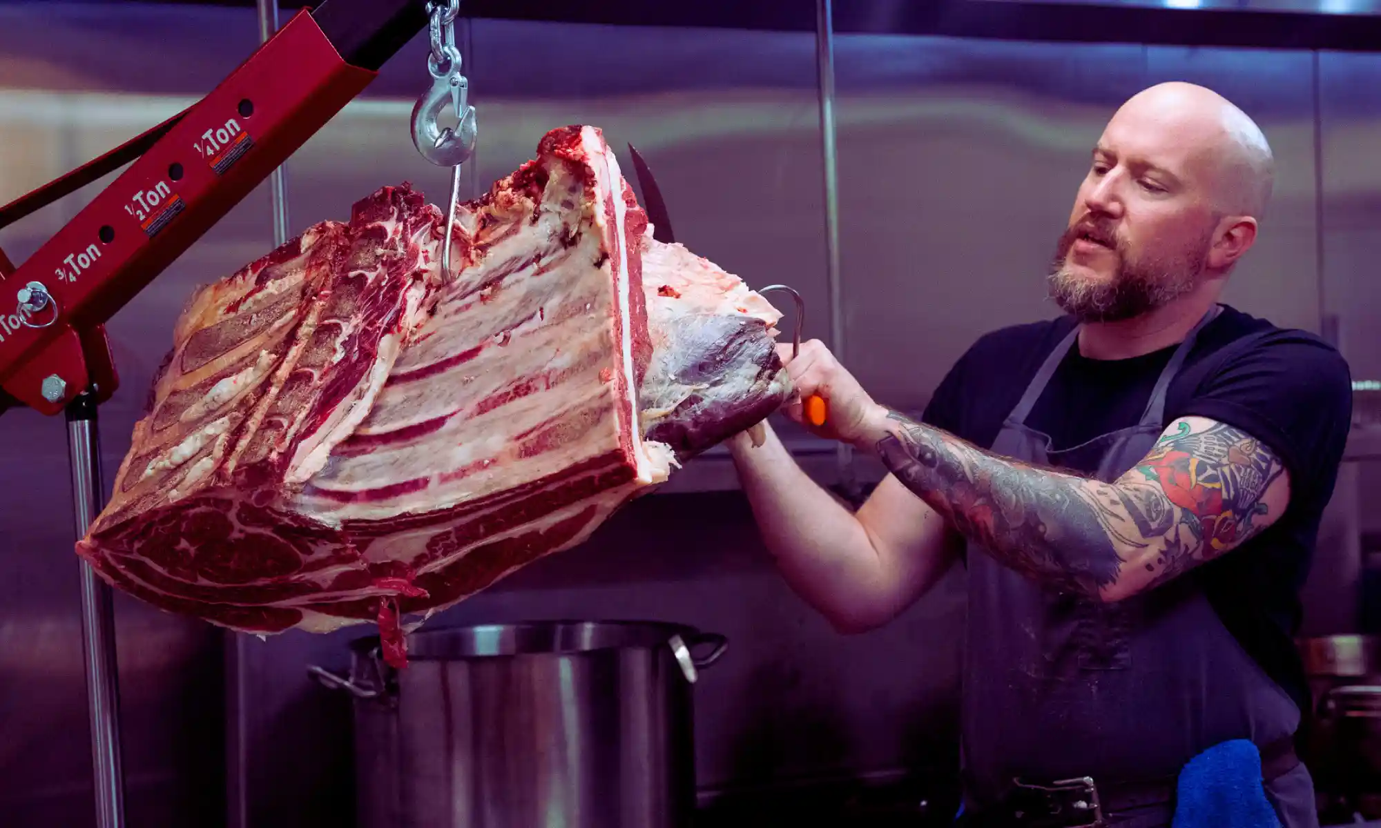 Butcher processing a beef share at Carnation Farms for farm-direct beef customers.