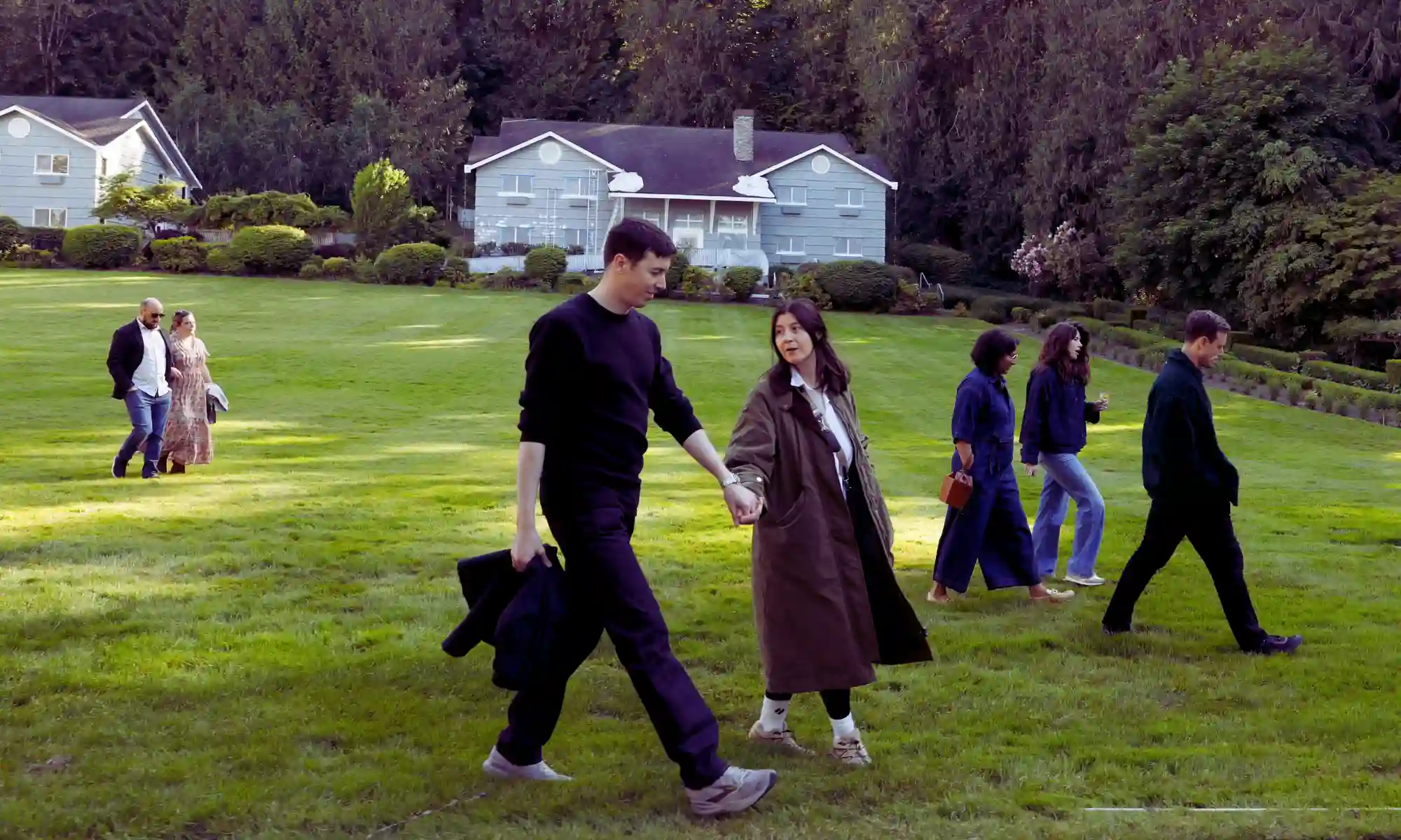 Wedding guests gathering outdoors for a rehearsal dinner near Seattle