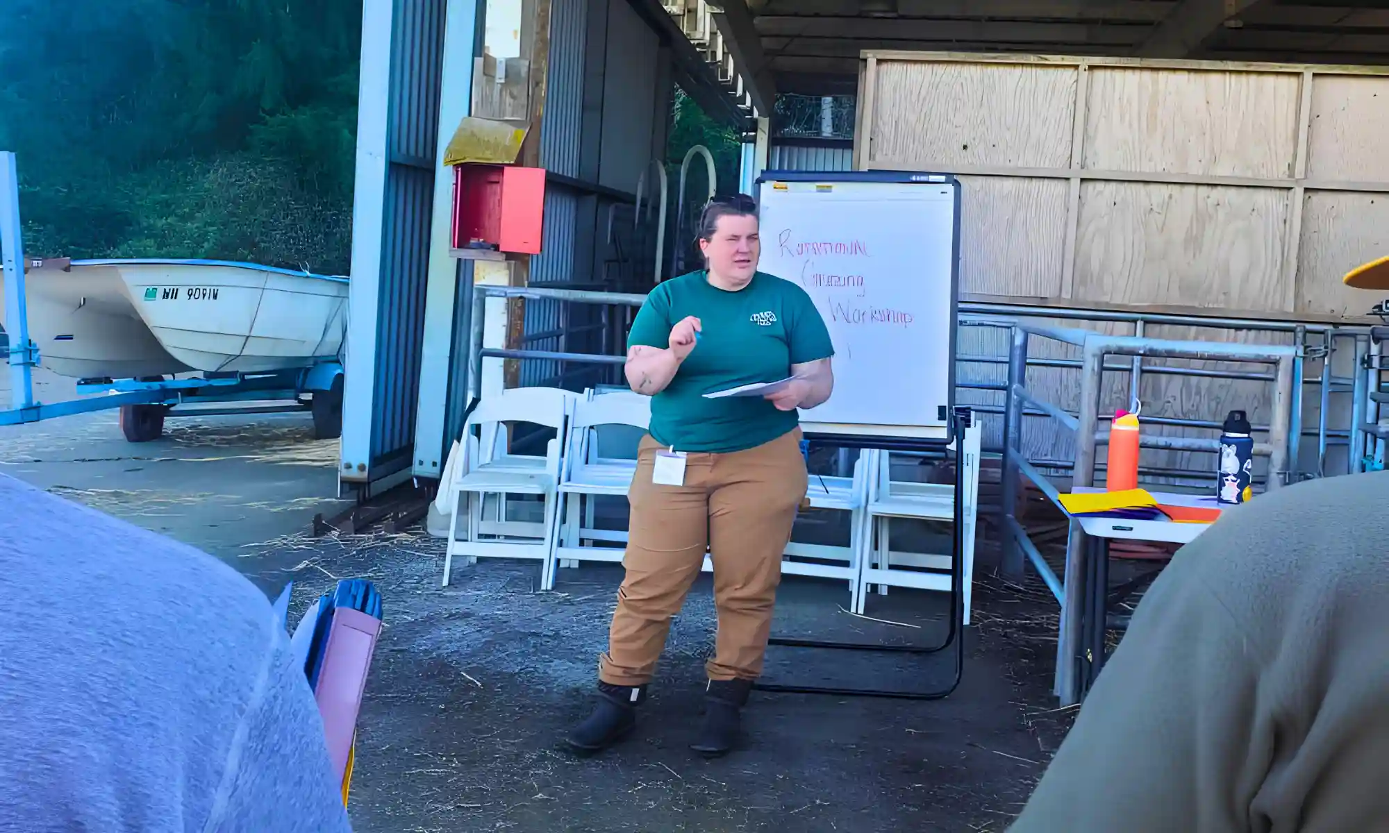 Farm educator leading a hands-on agricultural learning session at Carnation Farms