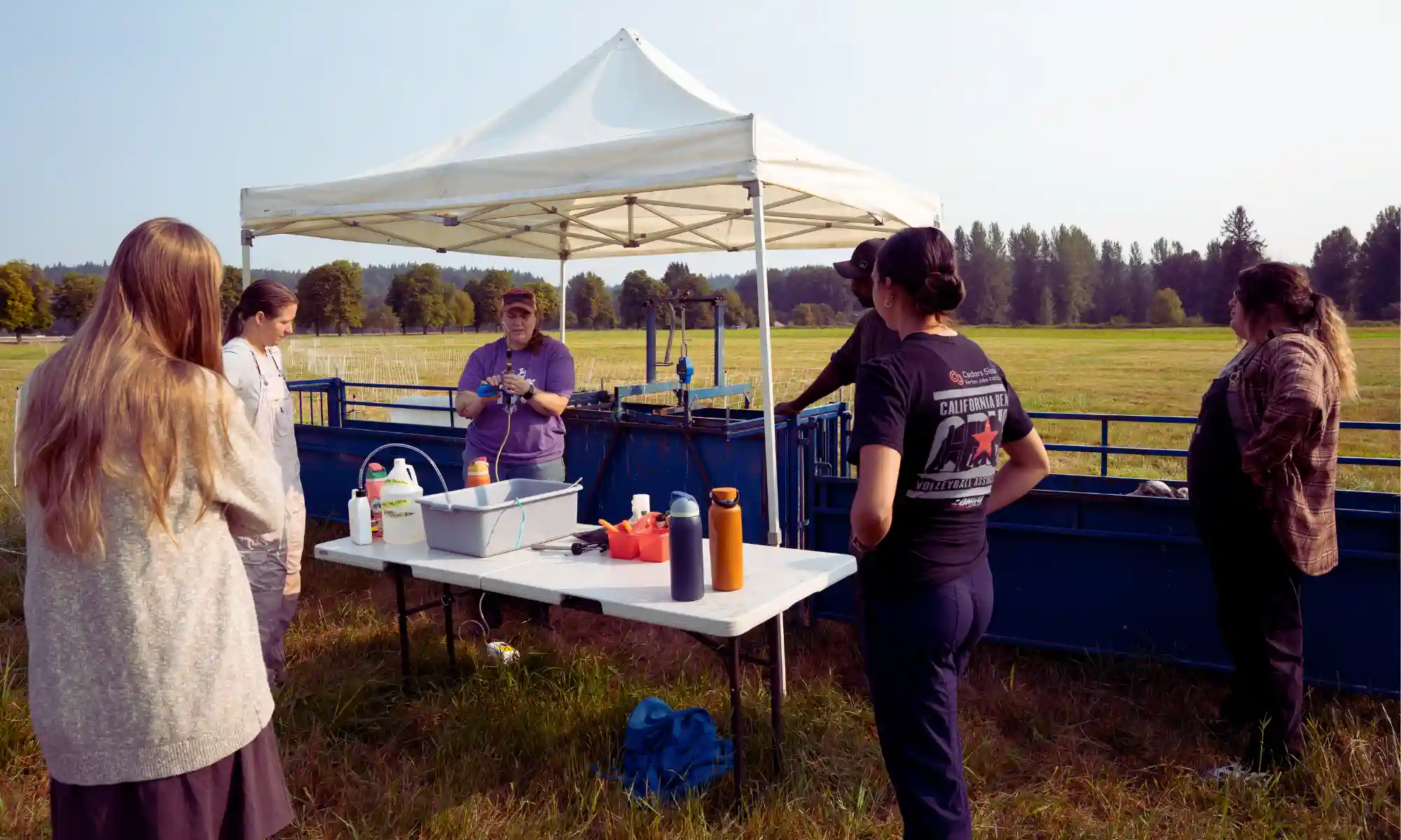 Participants learning hands-on farming skills with the Carnation Farms team